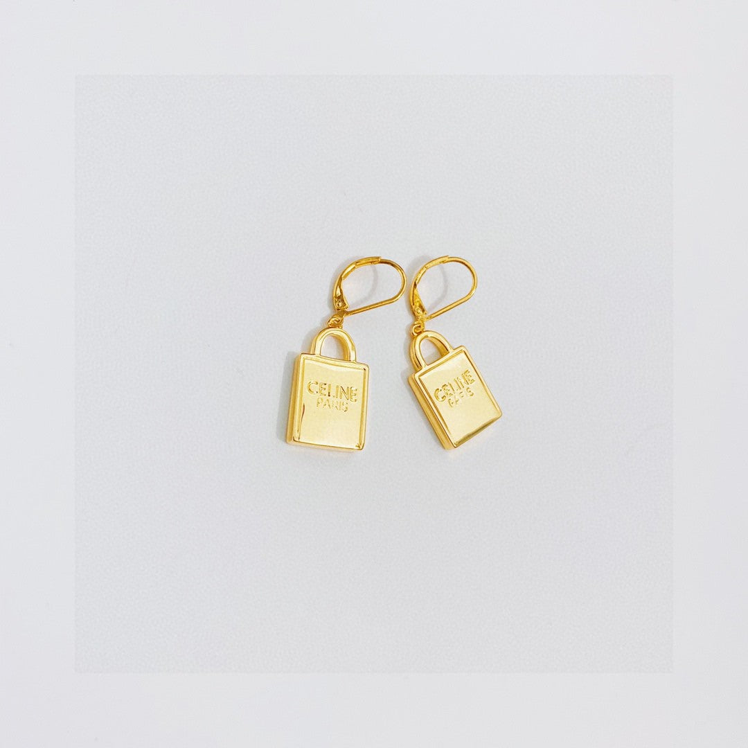 Martin Graham stud earrings in polished metal-tone