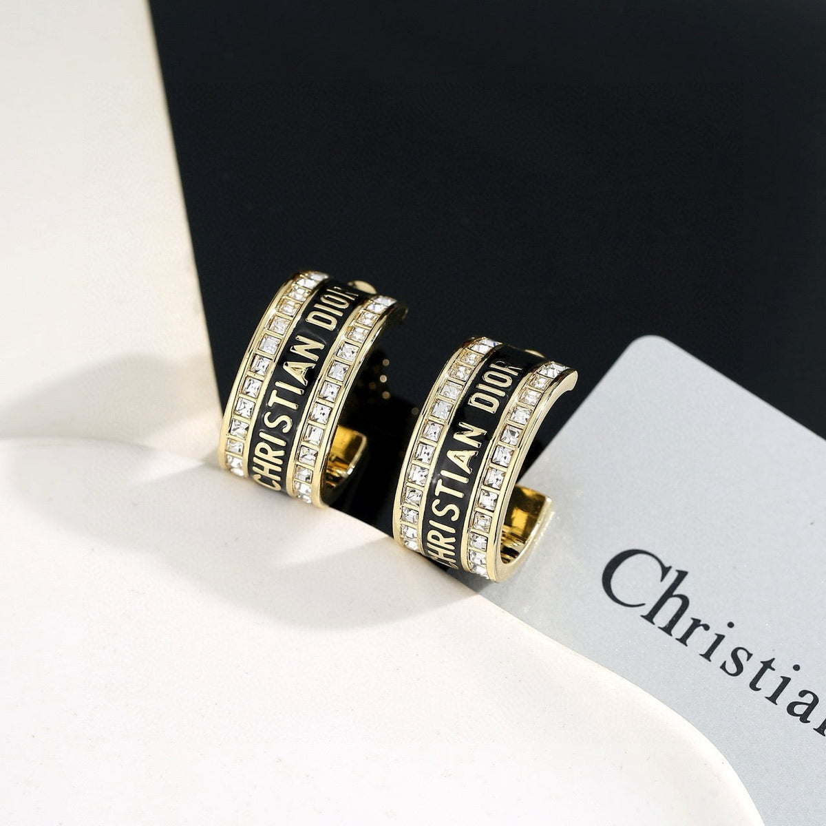 Martin Graham earrings in polished metal-tone – close-up detail