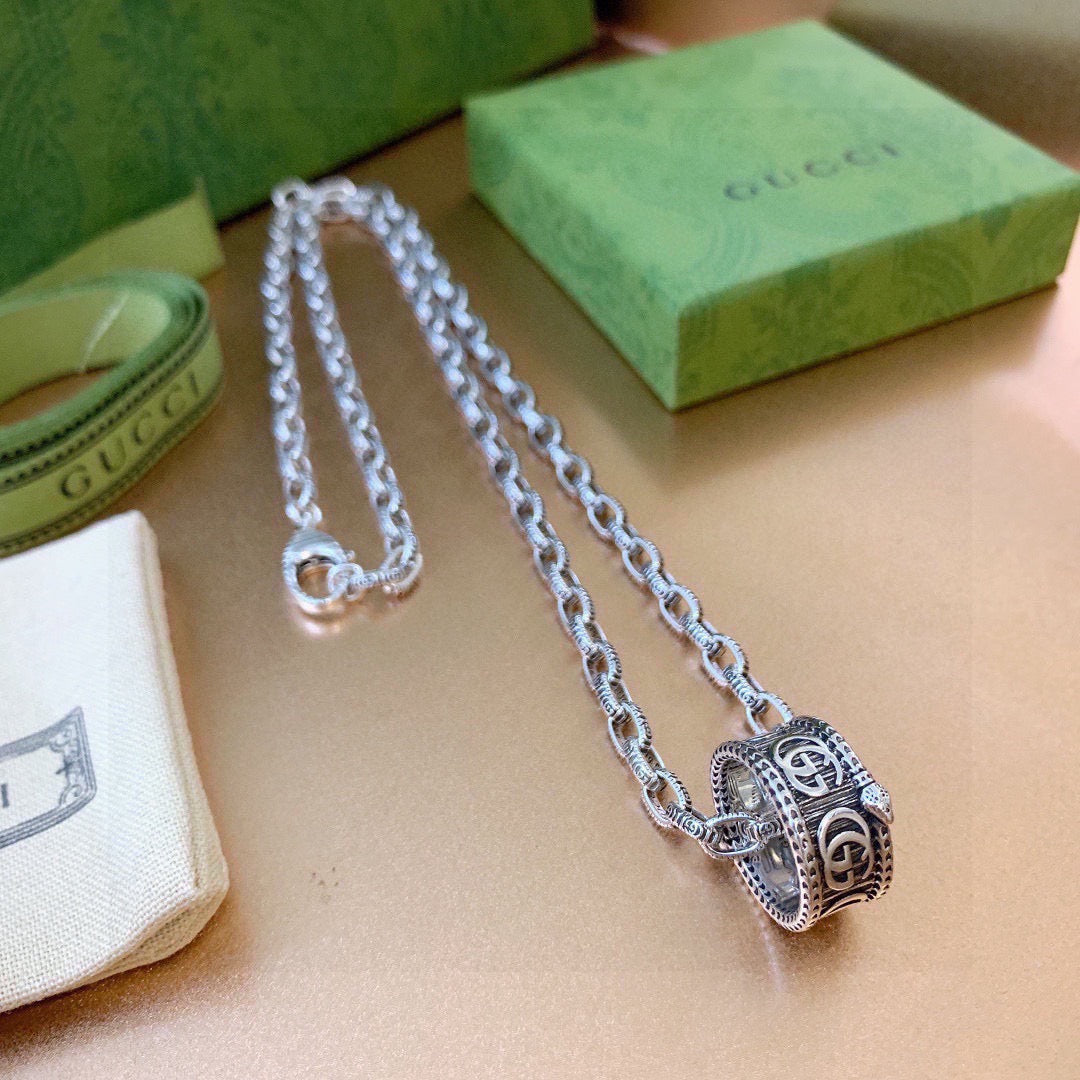 Martin Graham pendant necklace in polished metal-tone – styled product view