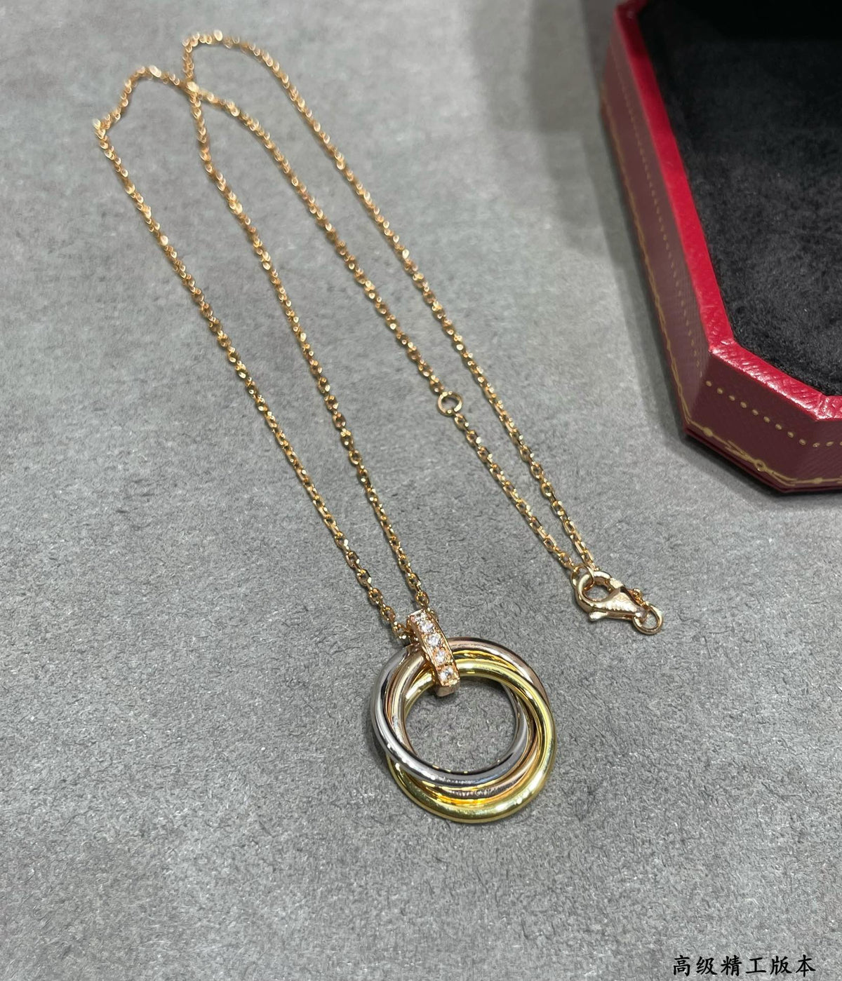 Martin Graham pendant necklace in polished metal-tone – close-up detail
