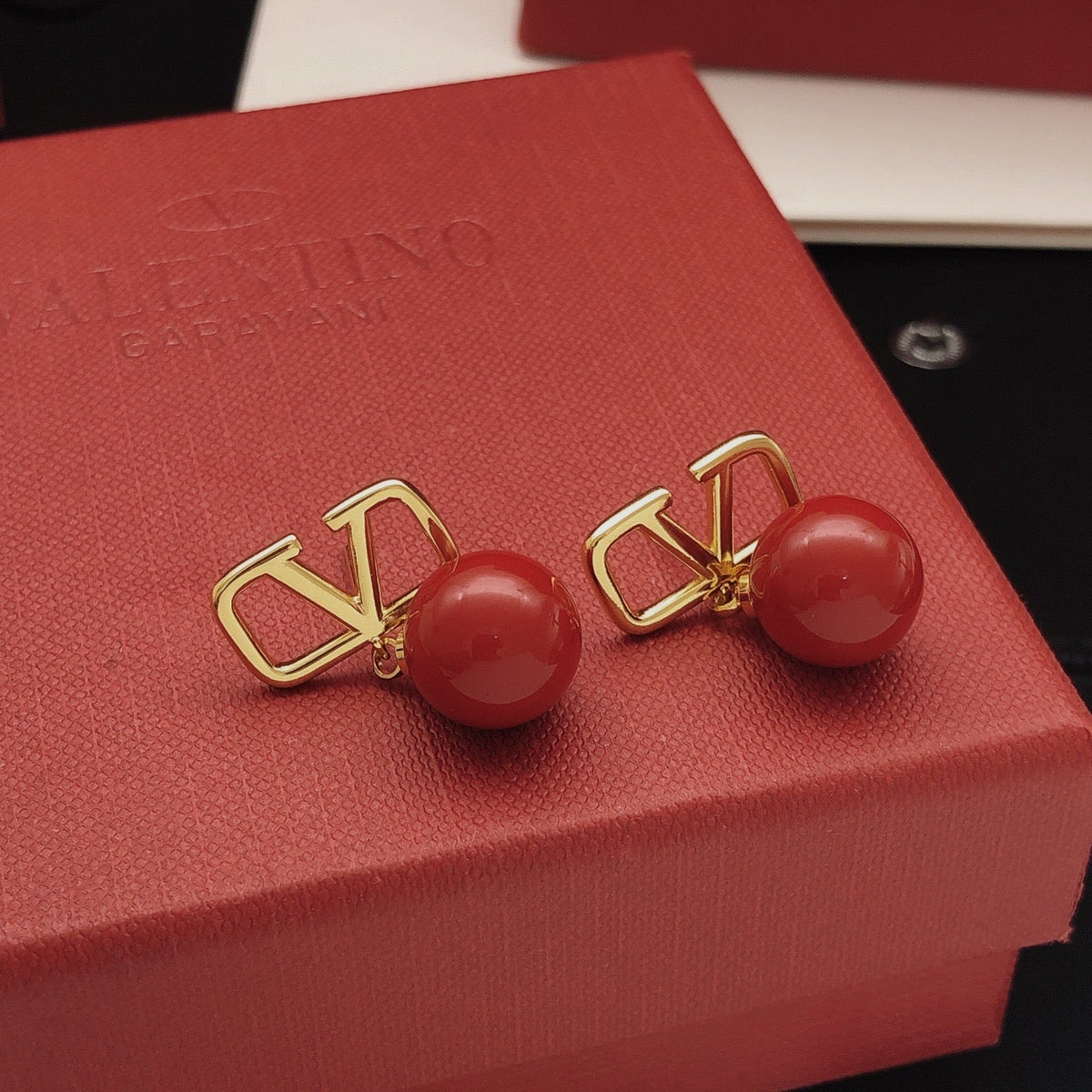 Martin Graham stud earrings in polished metal-tone