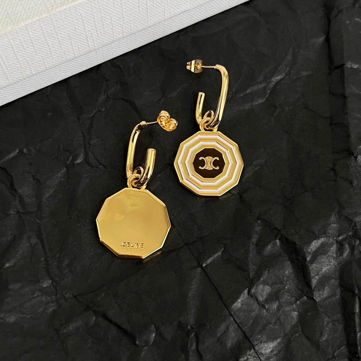 Martin Graham stud earrings in polished metal-tone