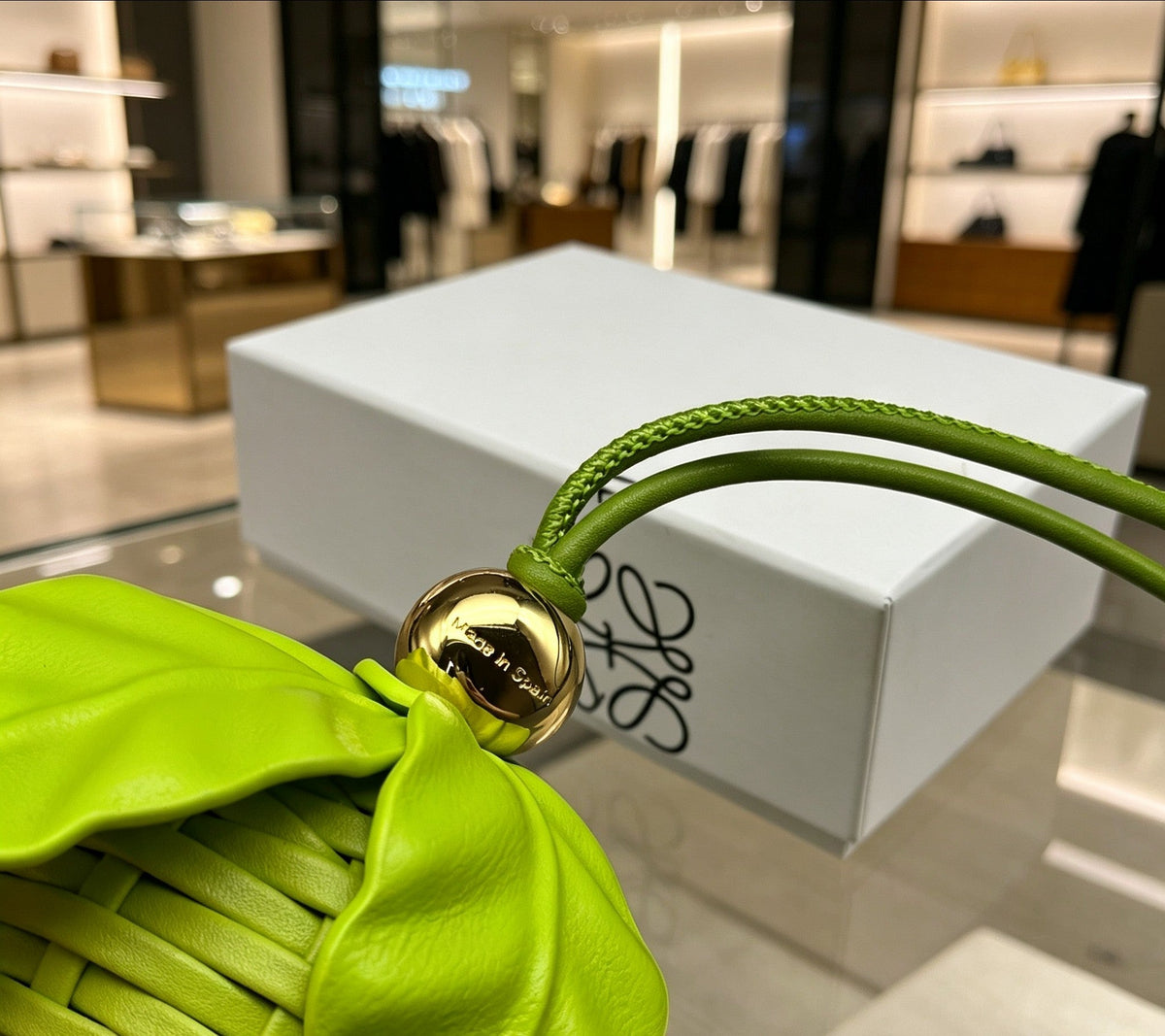 Martin Graham bag charm in polished metal-tone – close-up detail