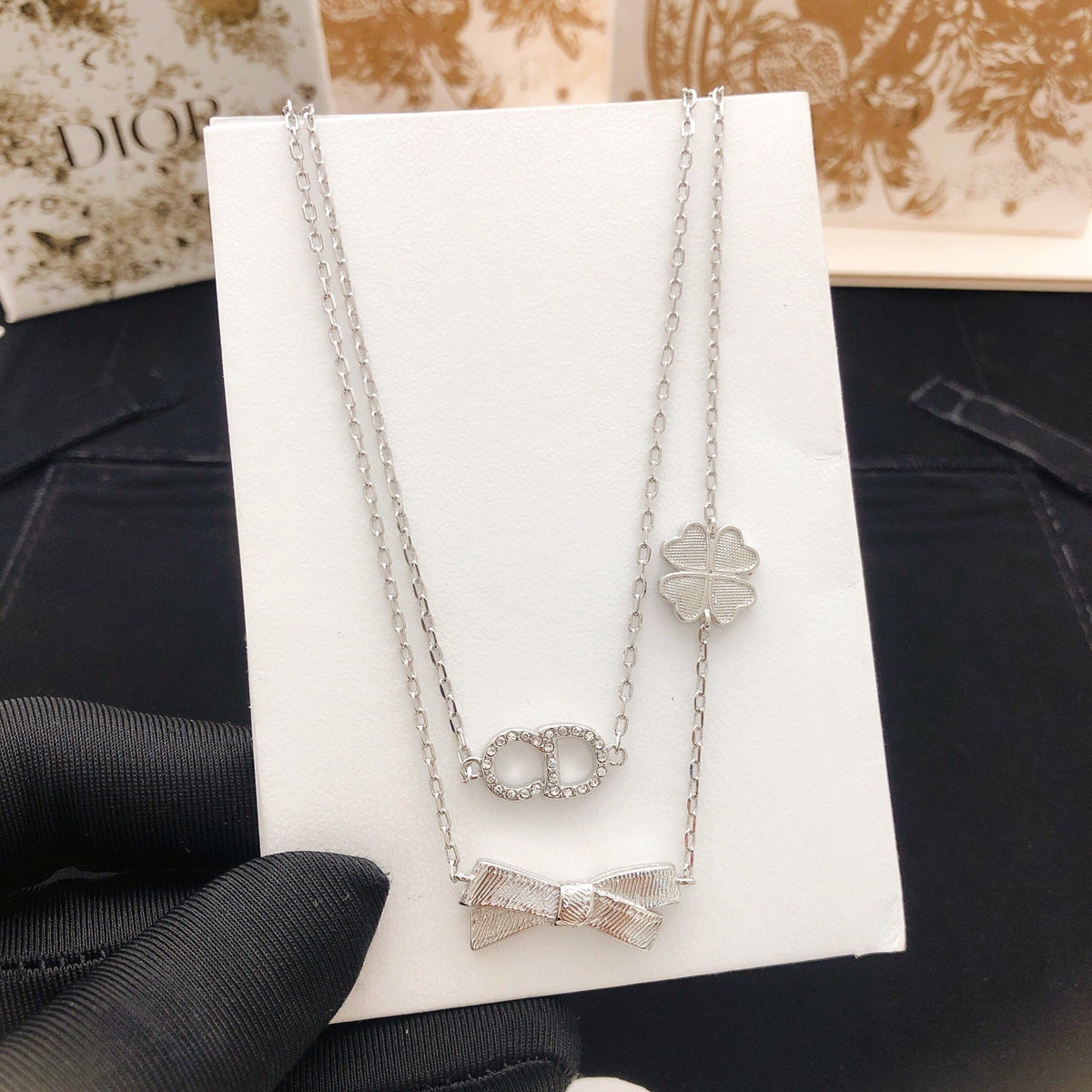 Martin Graham pendant necklace in polished metal-tone – close-up detail