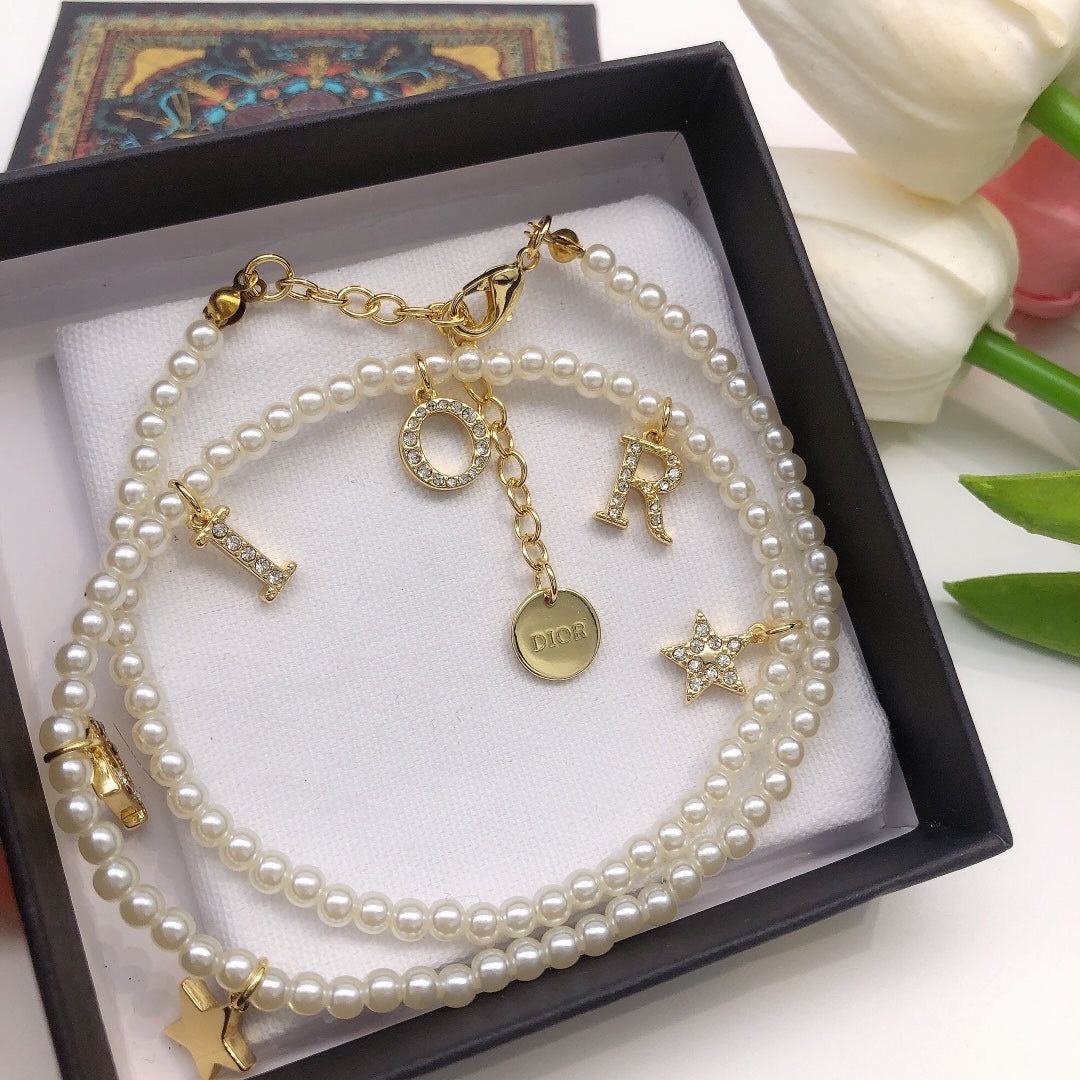 Martin Graham pendant necklace in polished metal-tone – close-up detail