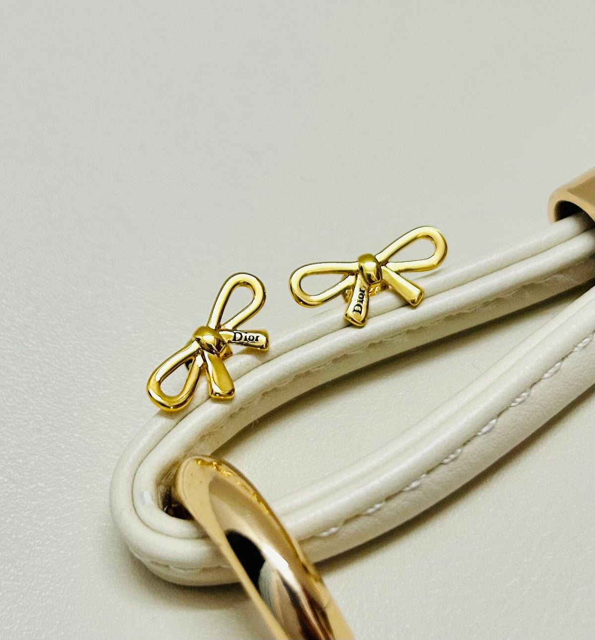 Martin Graham earrings in polished metal-tone – close-up detail