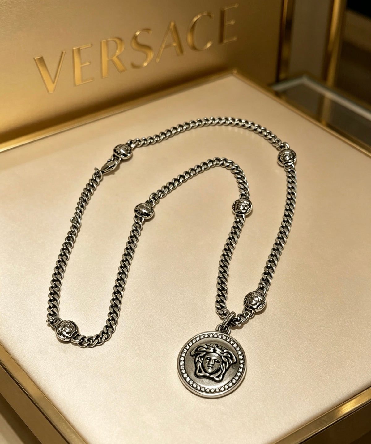 Martin Graham pendant necklace in polished metal-tone – close-up detail