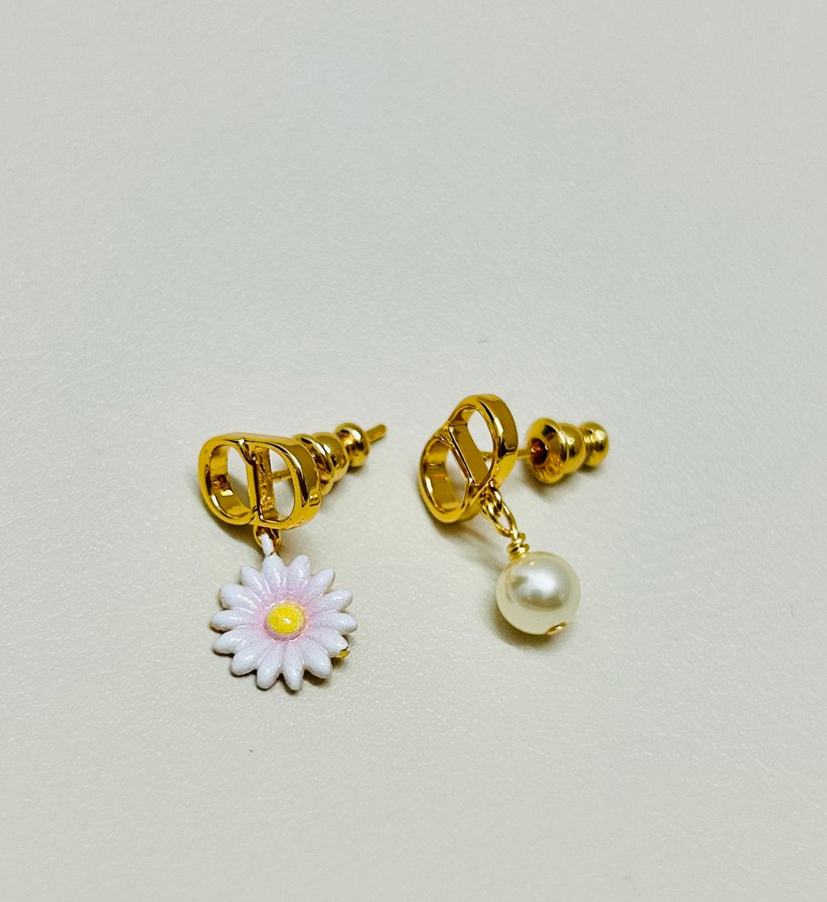 Martin Graham earrings in polished metal-tone – close-up detail