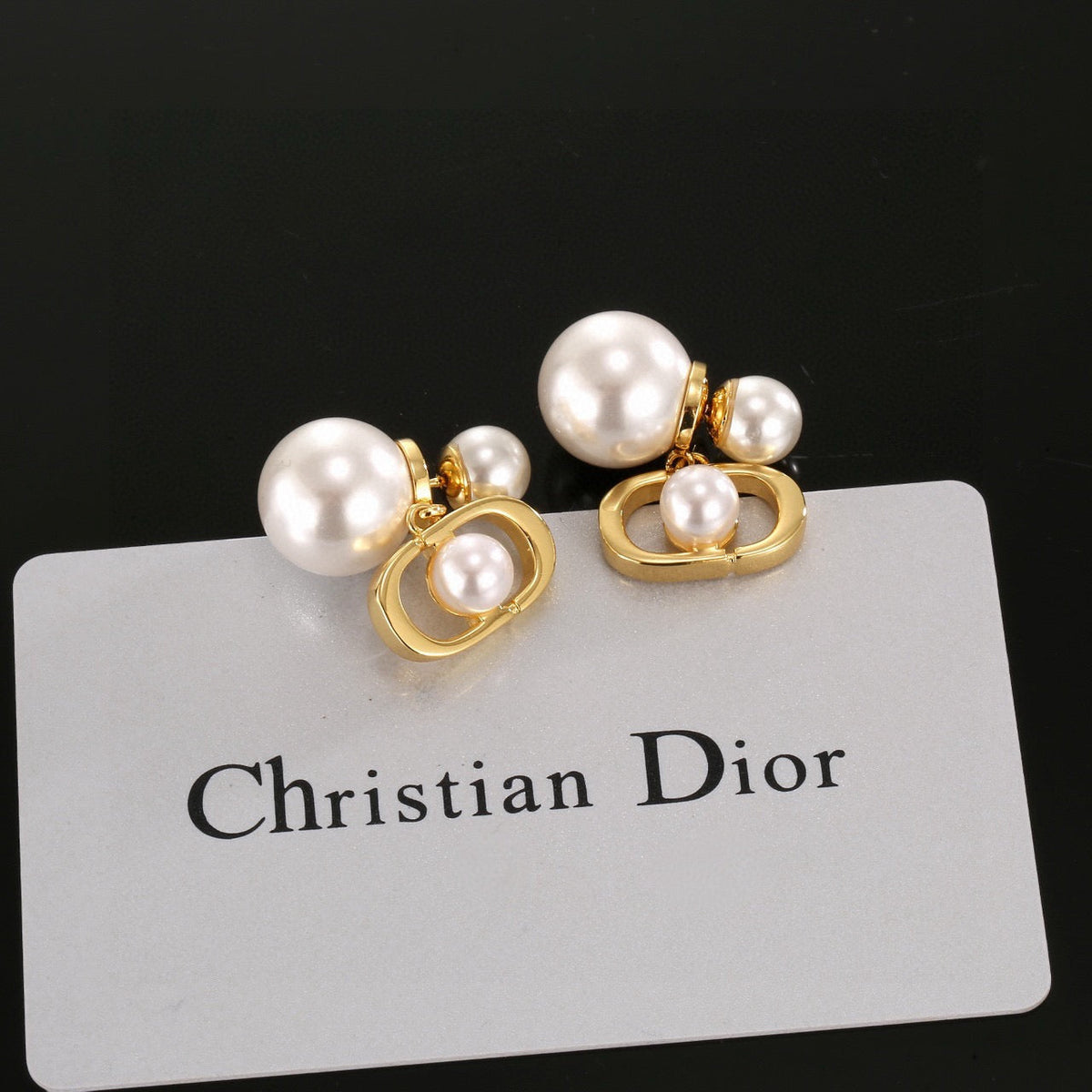 Martin Graham earrings in polished metal-tone – close-up detail