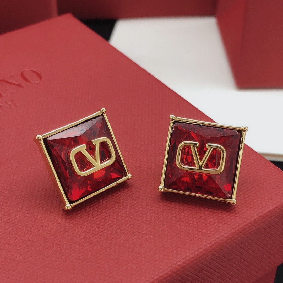 Martin Graham stud earrings in polished metal-tone