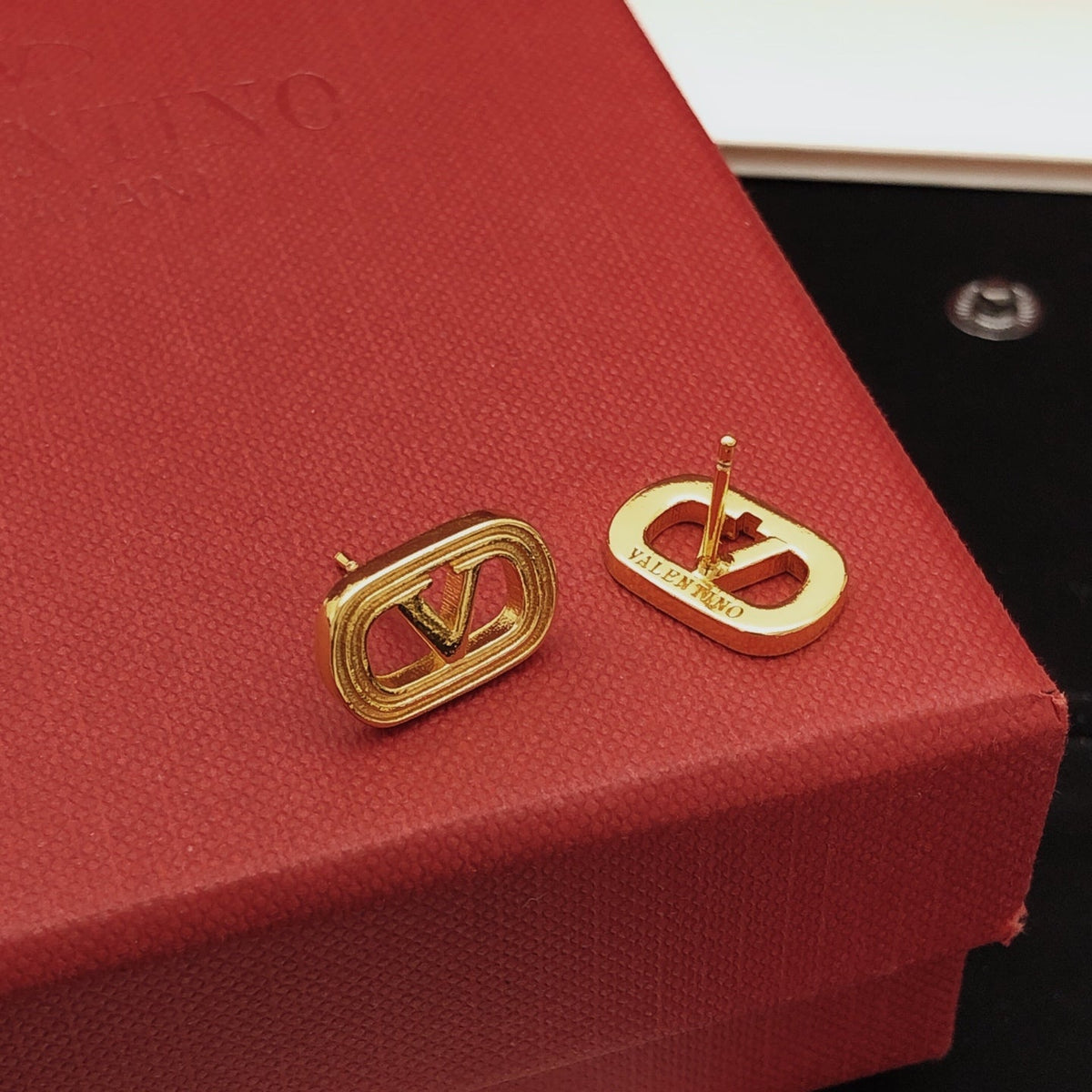 Martin Graham stud earrings in polished metal-tone
