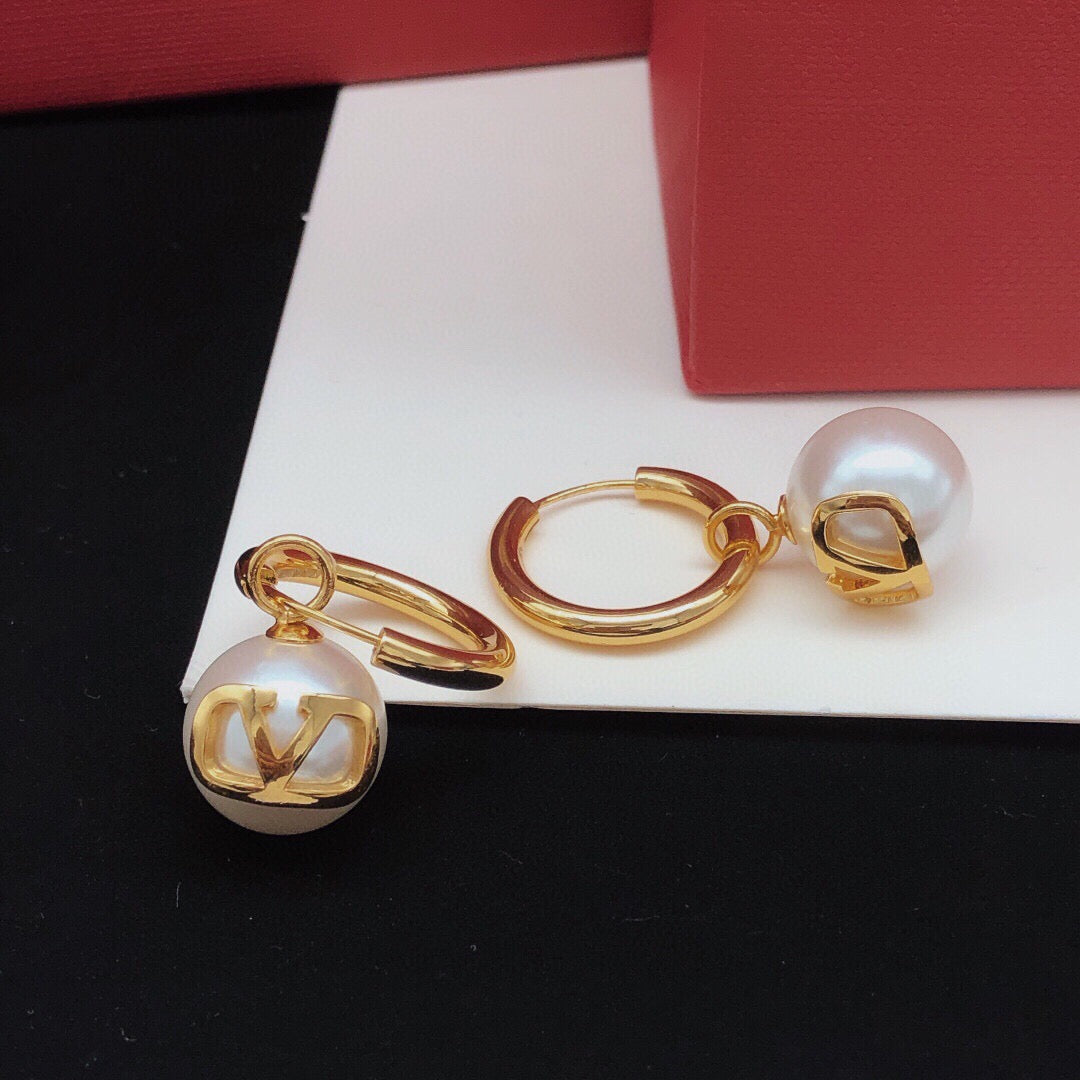 Martin Graham drop earrings in polished metal-tone