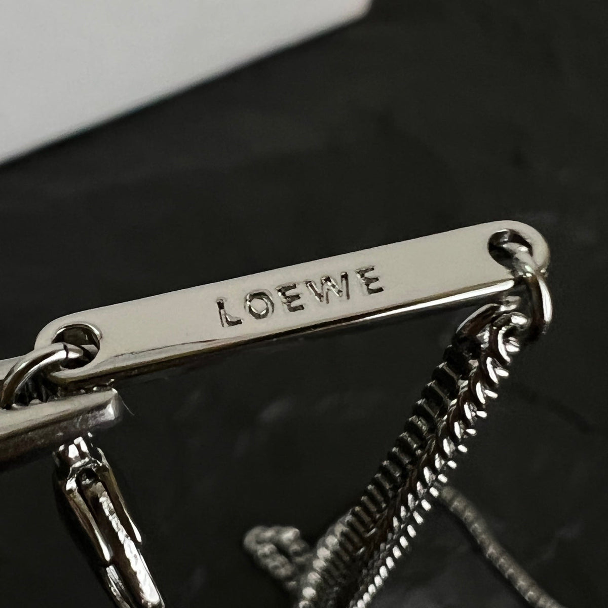 Martin Graham pendant necklace in polished metal-tone – close-up detail
