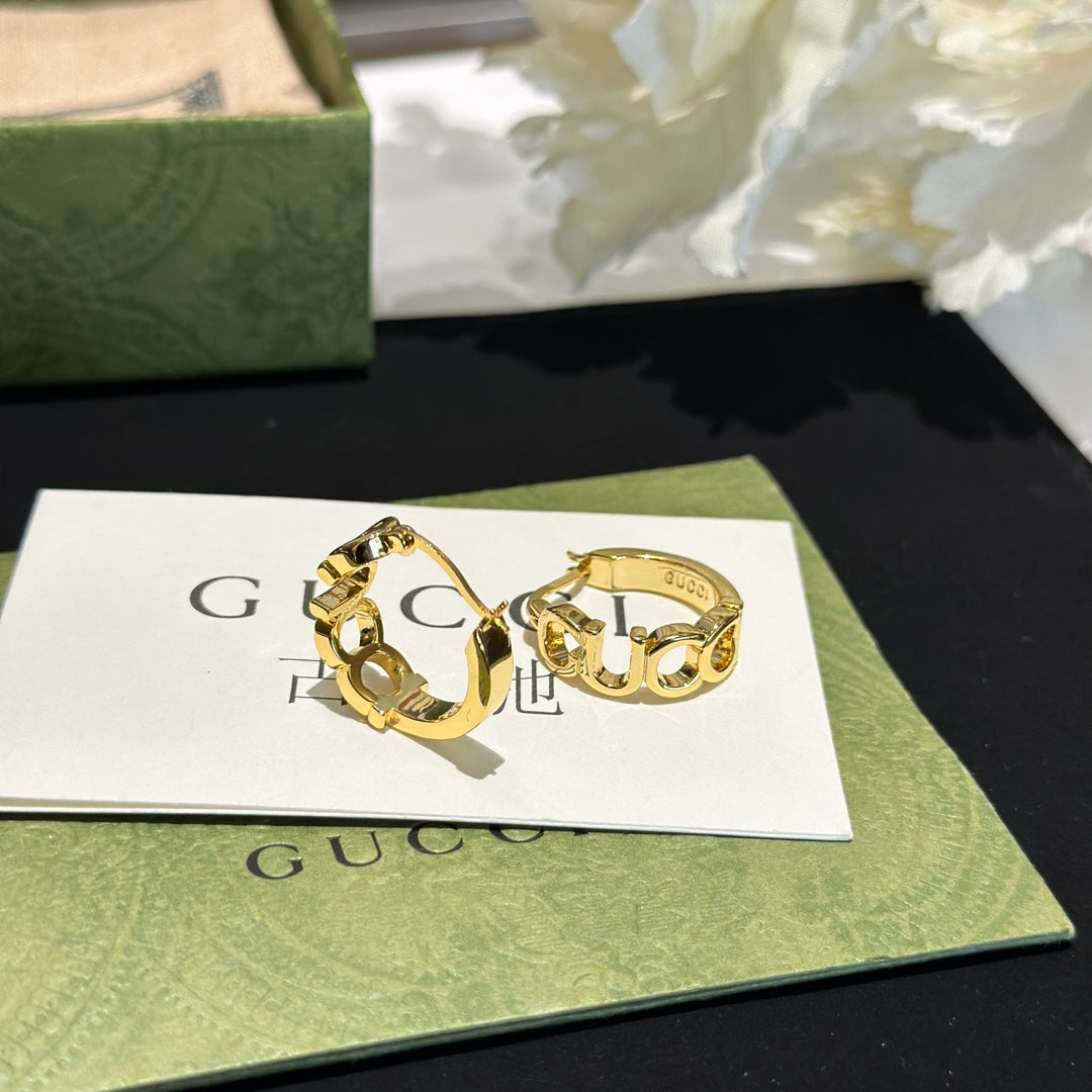 Martin Graham earrings in polished metal-tone – styled product view