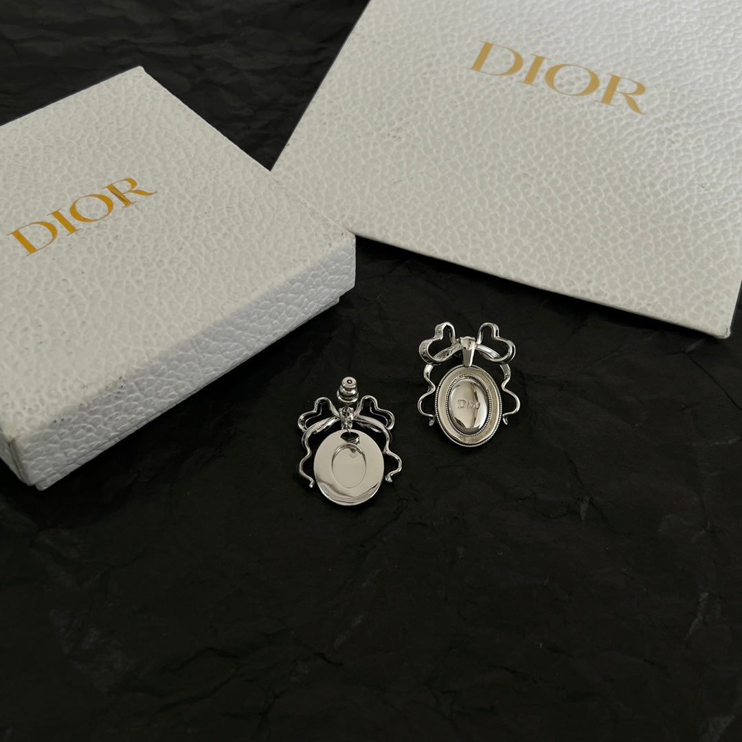 Martin Graham stud earrings in polished metal-tone – close-up detail