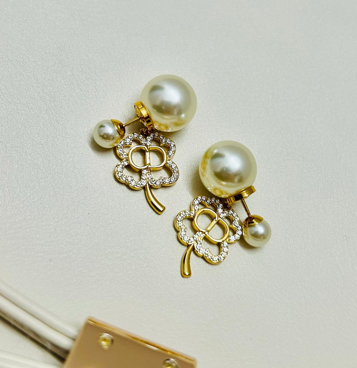 Martin Graham earrings in polished metal-tone – close-up detail