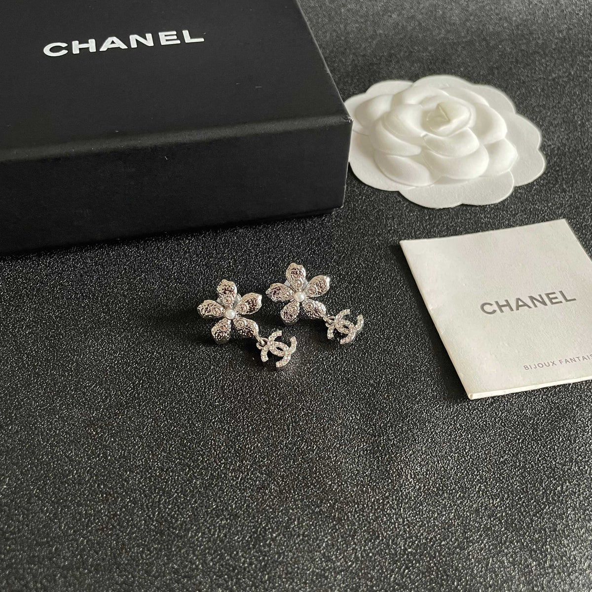 Martin Graham stud earrings in polished metal-tone – styled product view