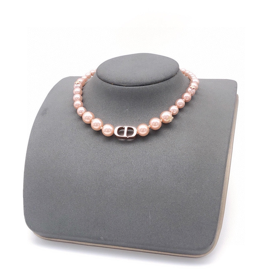 Martin Graham pendant necklace in polished metal-tone – close-up detail