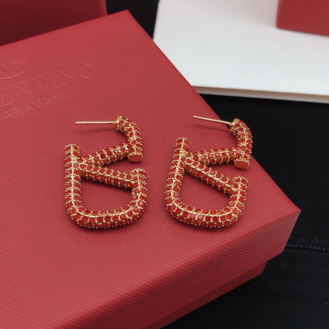Martin Graham stud earrings in polished metal-tone