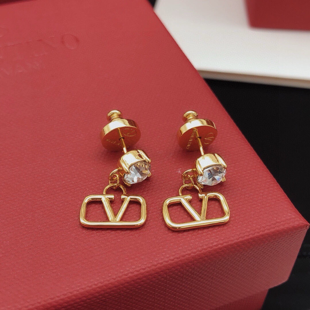 Martin Graham stud earrings in polished metal-tone