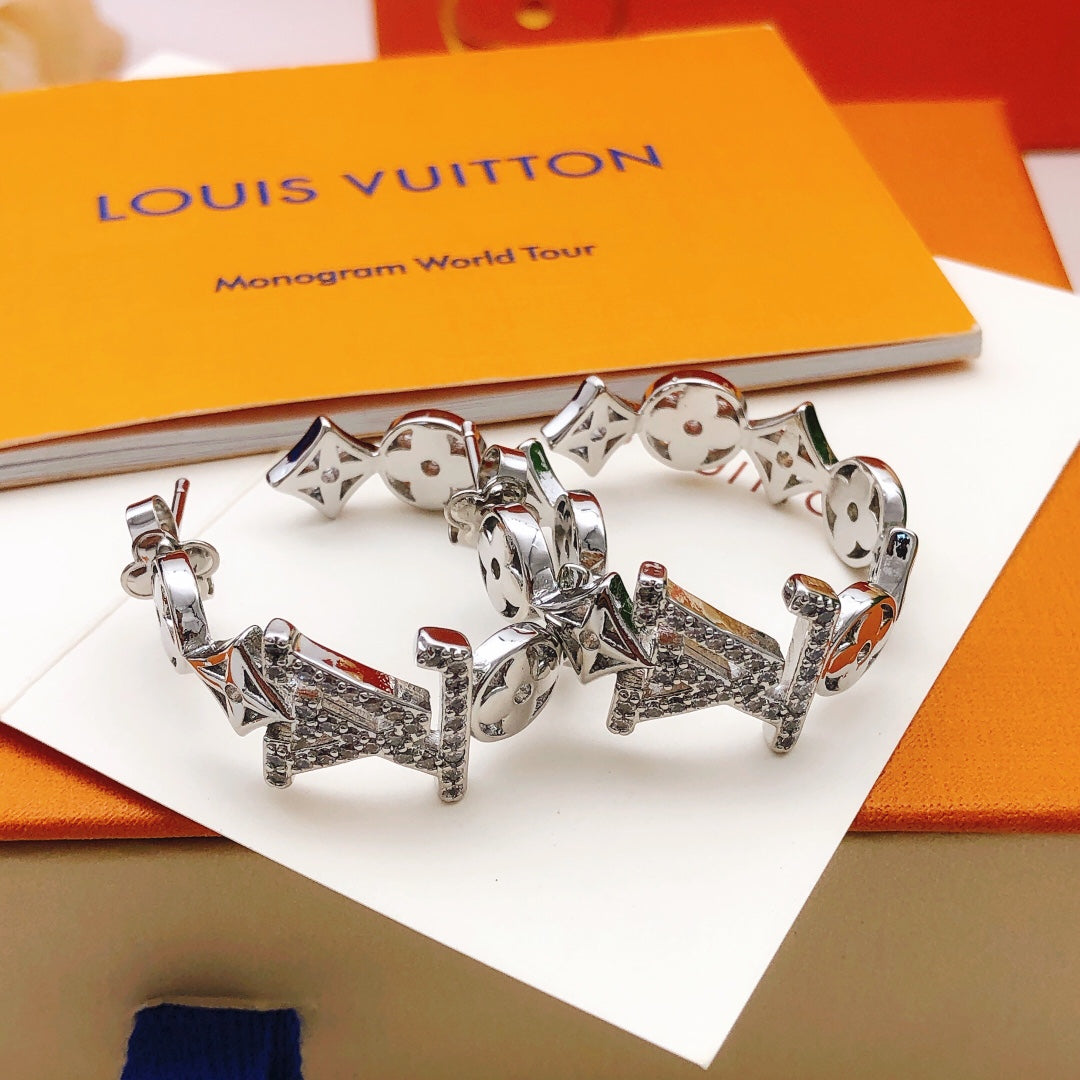 Martin Graham earrings in polished metal-tone – close-up detail