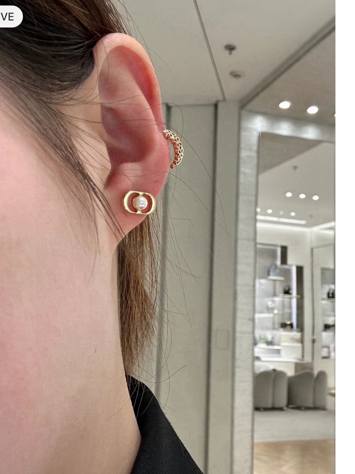 Martin Graham stud earrings in polished metal-tone – close-up detail