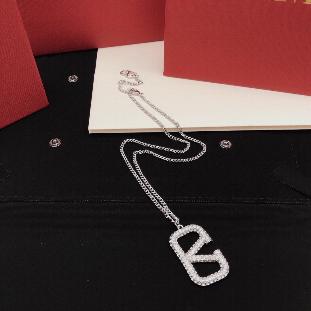 Martin Graham pendant necklace in polished metal-tone