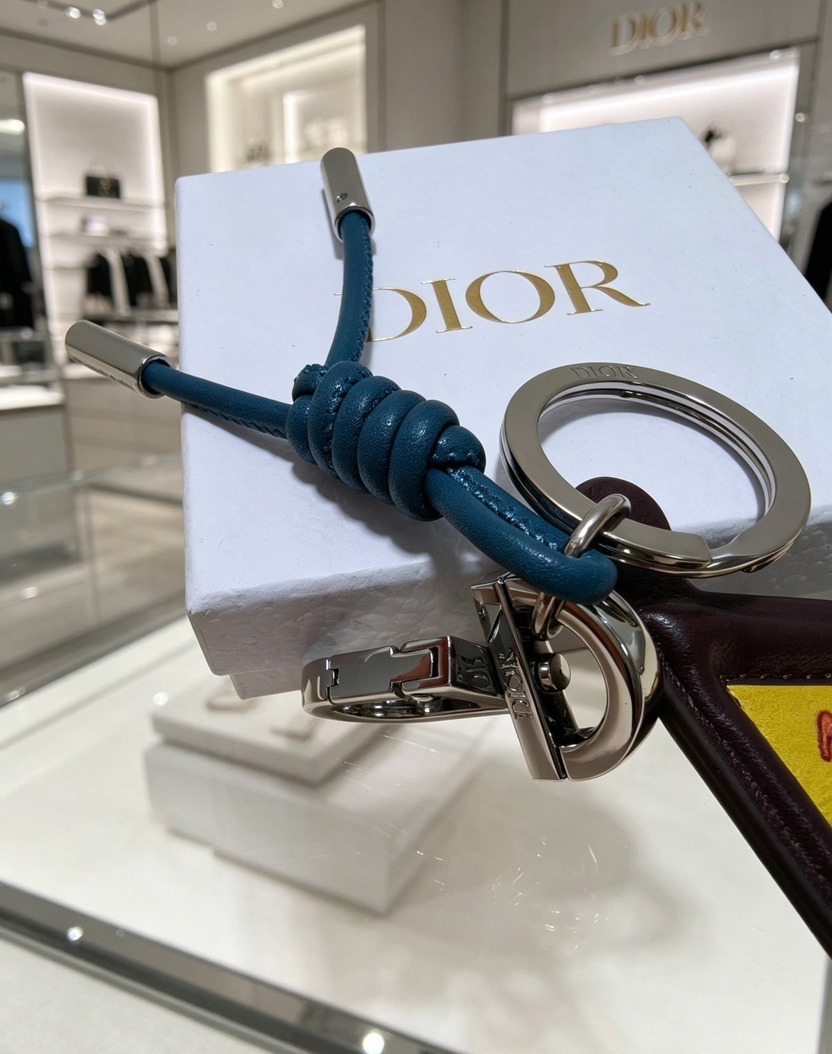 Martin Graham bag charm in polished metal-tone – close-up detail