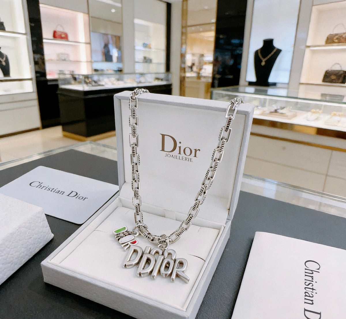 Martin Graham pendant necklace in polished metal-tone – close-up detail