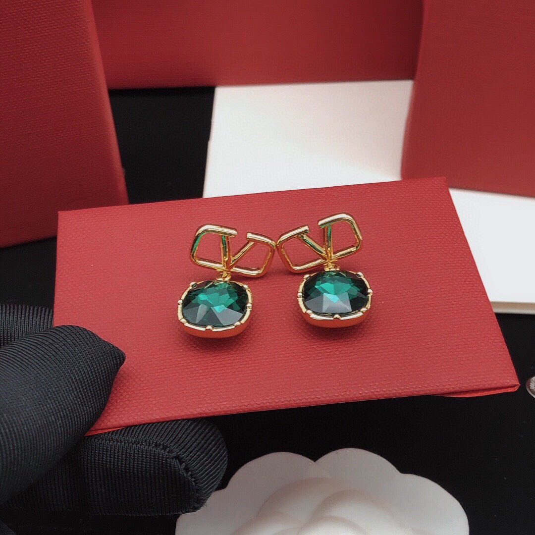 Martin Graham stud earrings in polished metal-tone