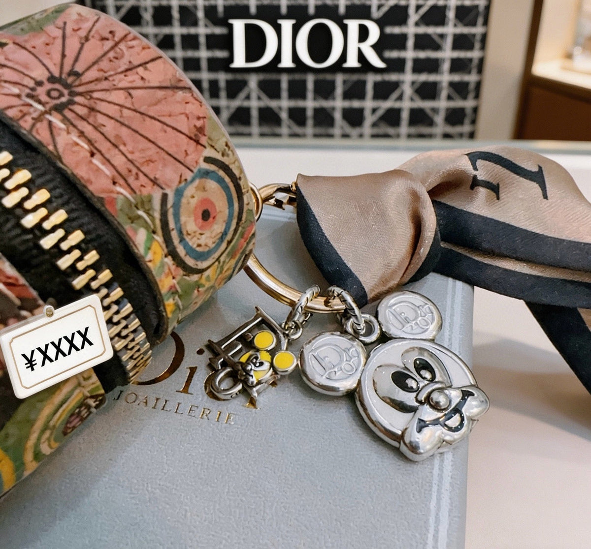 Martin Graham bag charm in polished metal-tone – close-up detail