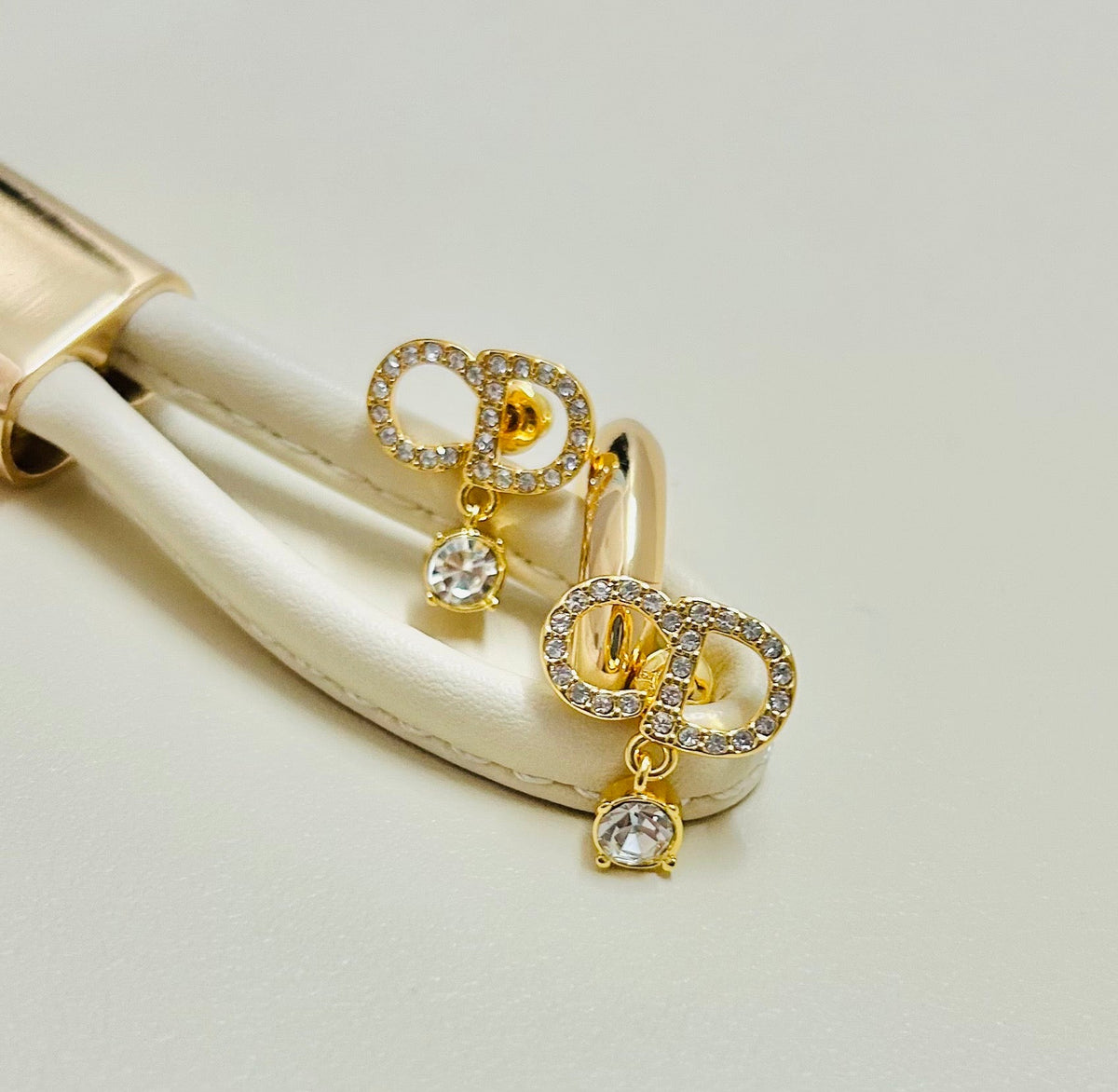 Martin Graham earrings in polished metal-tone – close-up detail