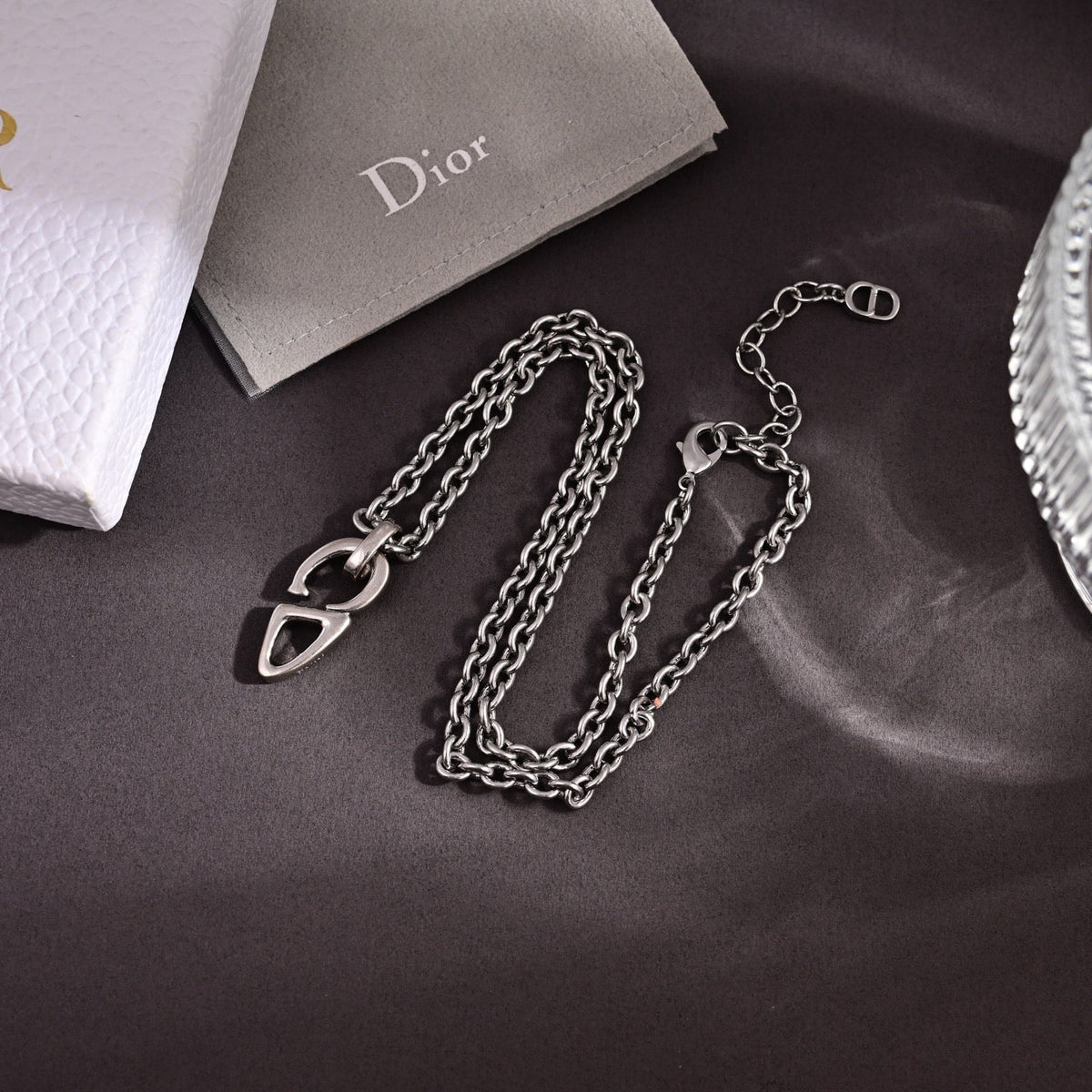 Martin Graham pendant necklace in polished metal-tone – close-up detail