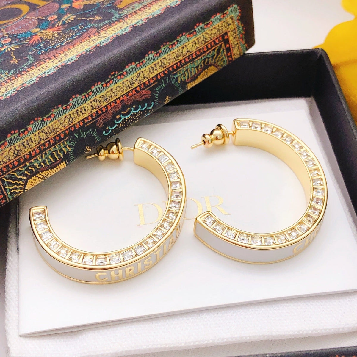 Martin Graham earrings in polished metal-tone – close-up detail