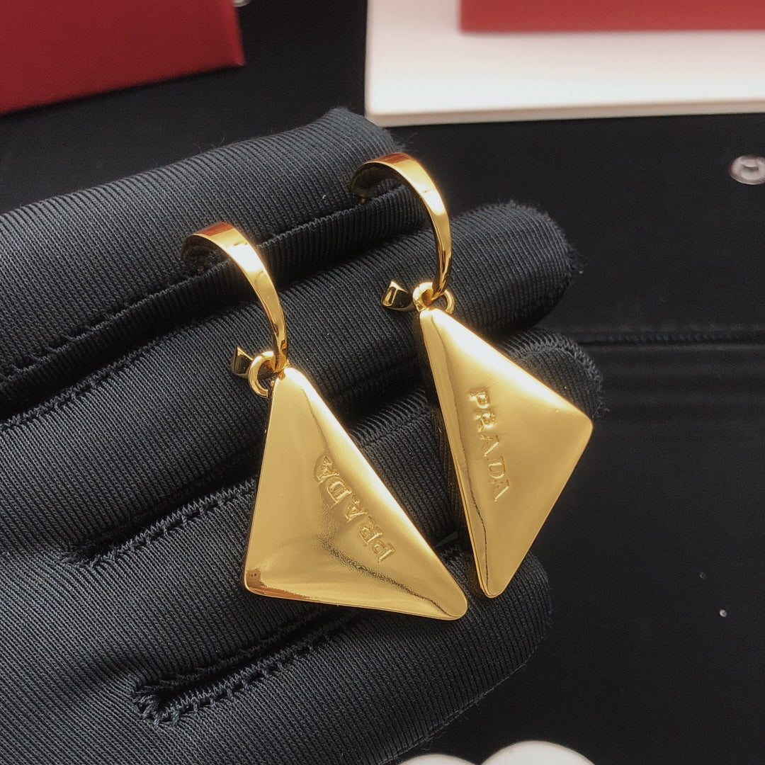 Martin Graham drop earrings in polished metal-tone