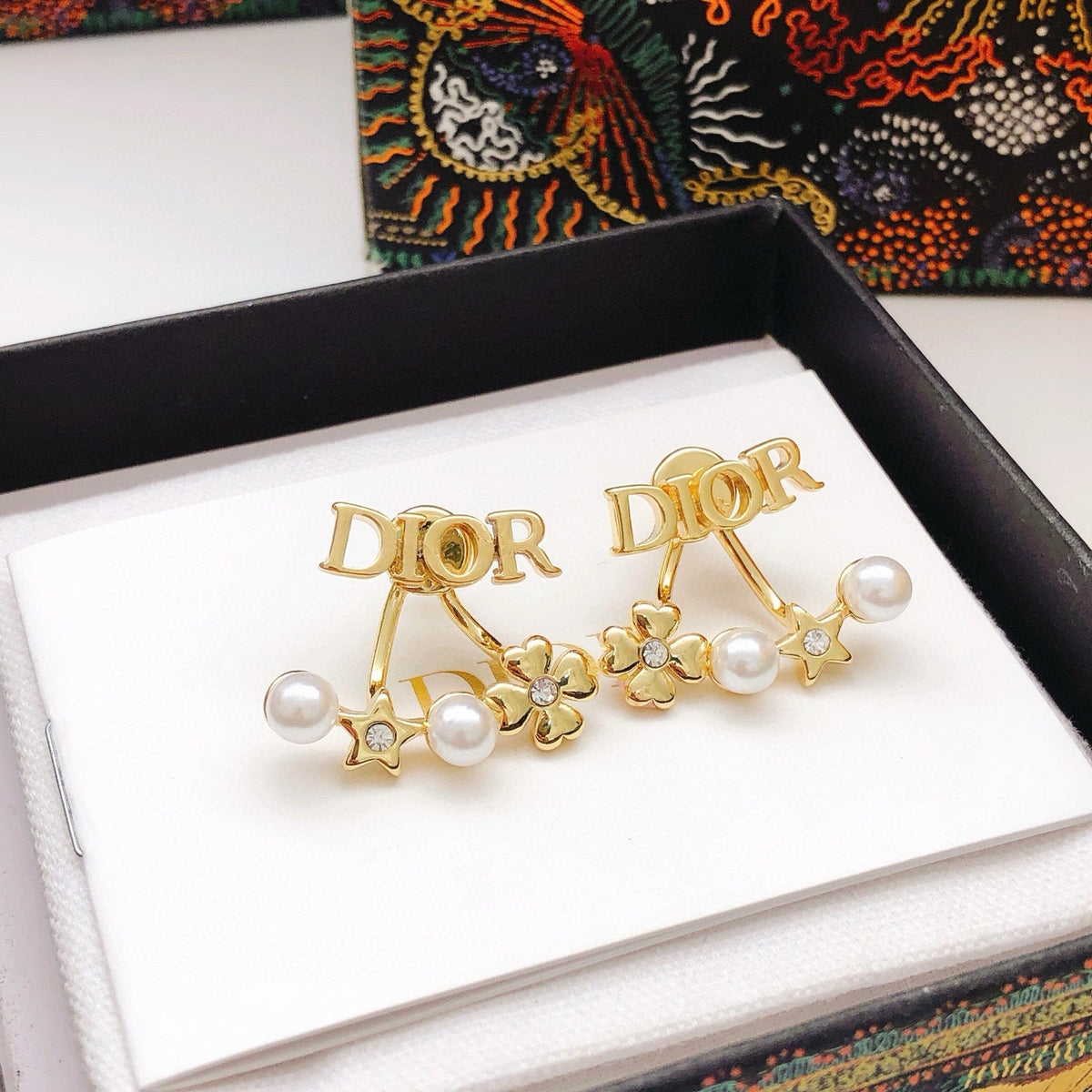 Martin Graham stud earrings in polished metal-tone – close-up detail