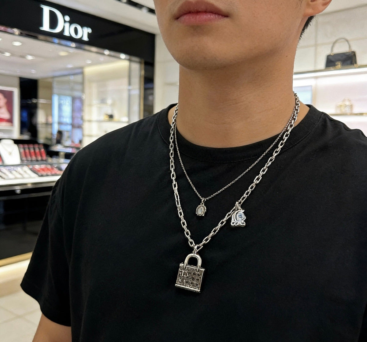 Martin Graham pendant necklace in polished metal-tone – close-up detail
