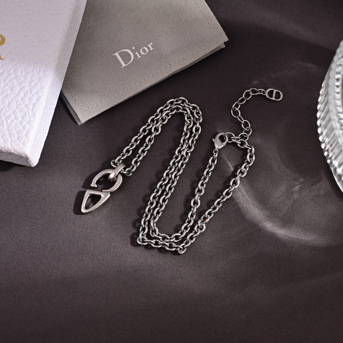 Martin Graham pendant necklace in polished metal-tone – close-up detail