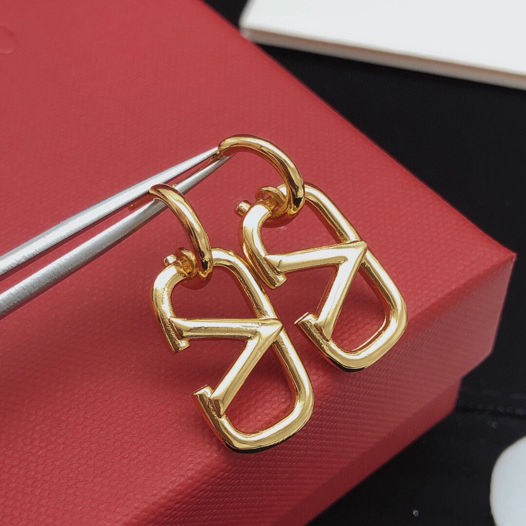 Martin Graham drop earrings in polished metal-tone