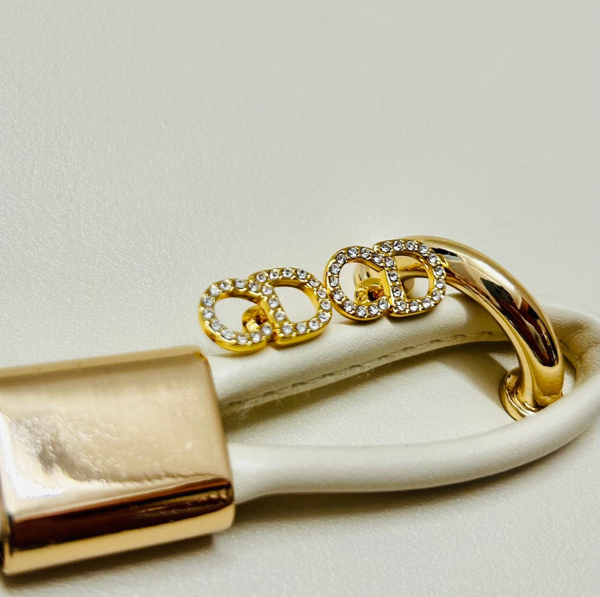 Martin Graham earrings in polished metal-tone – close-up detail