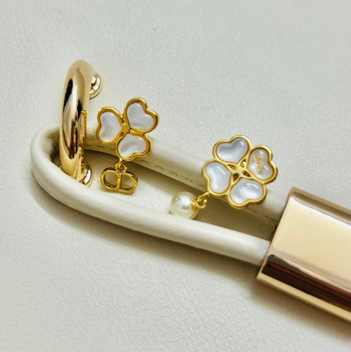 Martin Graham earrings in polished metal-tone – close-up detail