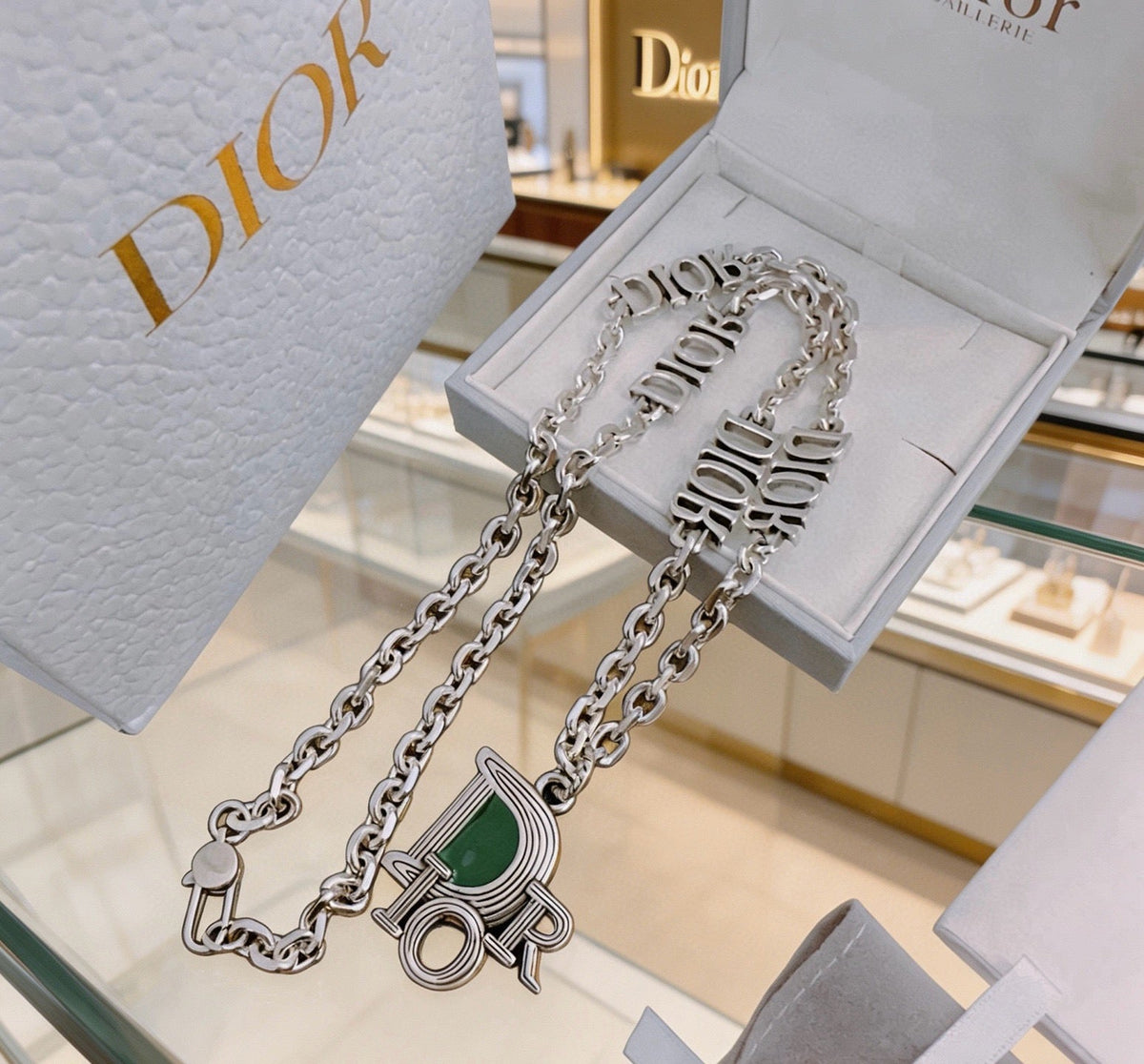 Martin Graham pendant necklace in polished metal-tone – close-up detail