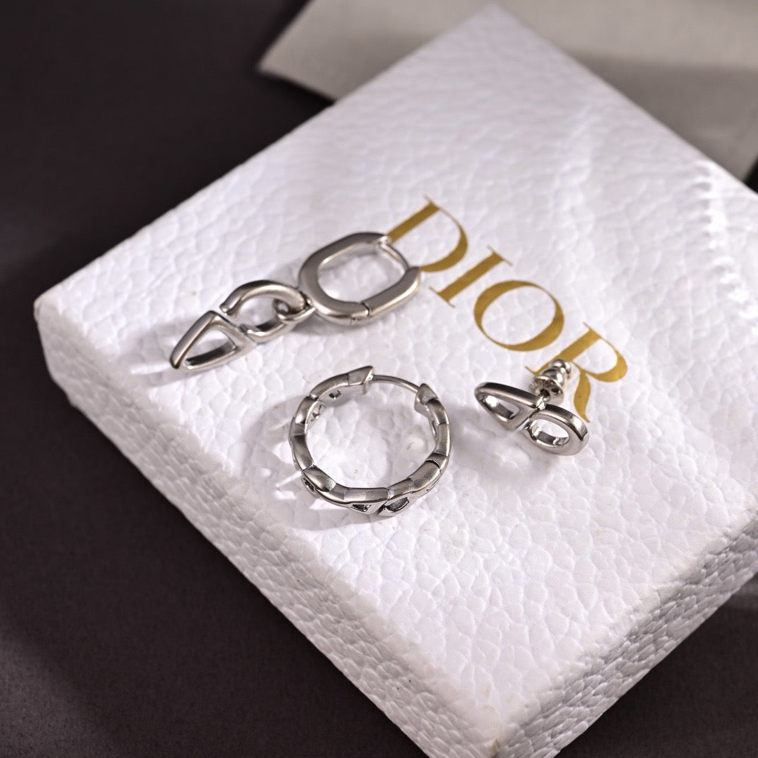 Martin Graham stud earrings in polished metal-tone – close-up detail