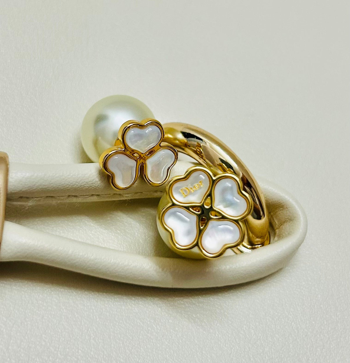Martin Graham earrings in polished metal-tone – close-up detail