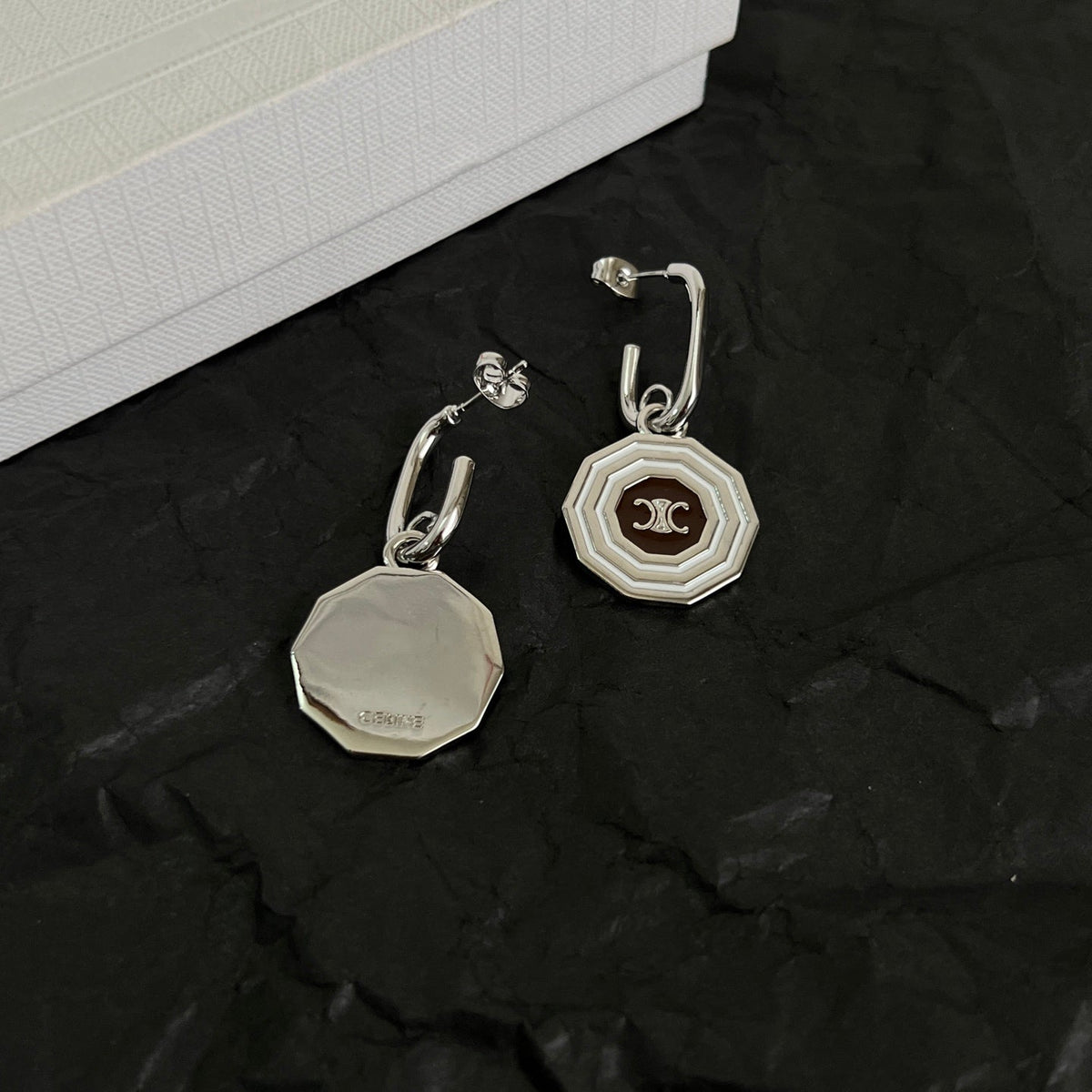 Martin Graham stud earrings in polished metal-tone