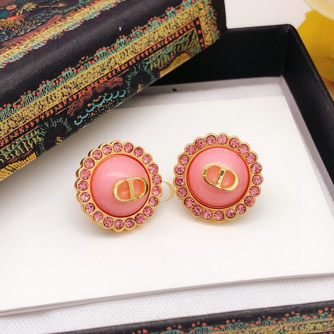 Martin Graham stud earrings in polished metal-tone – close-up detail