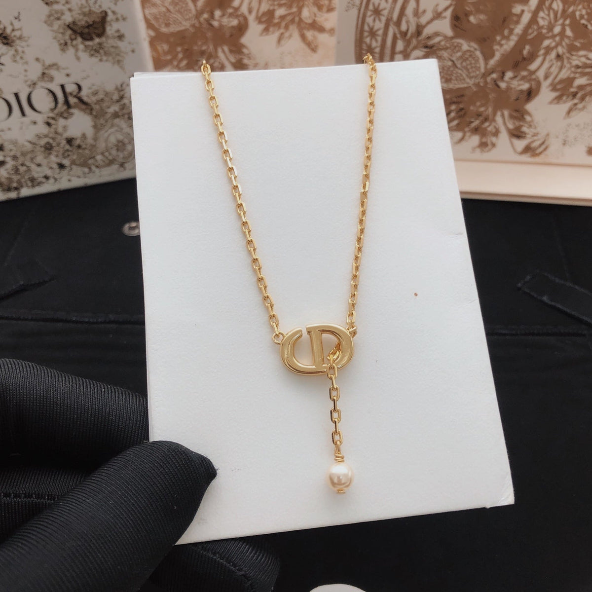 Martin Graham pendant necklace in polished metal-tone – close-up detail