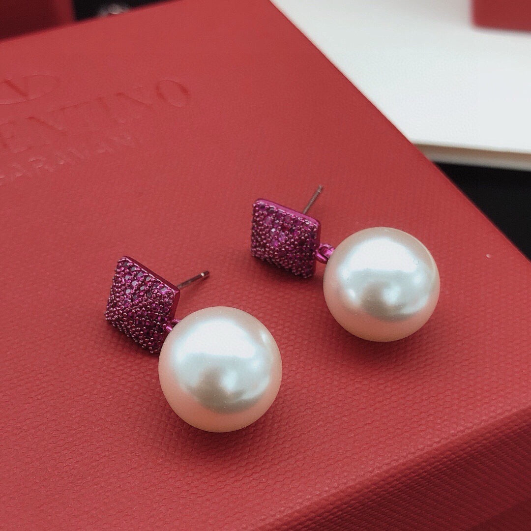Martin Graham stud earrings in polished metal-tone