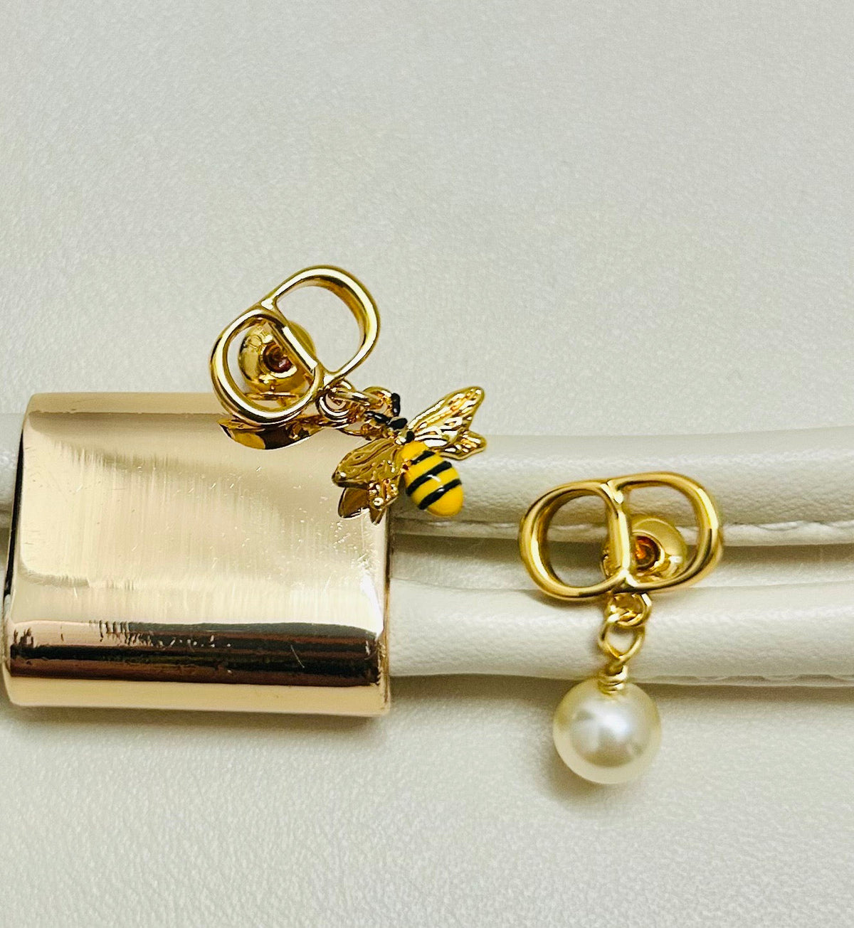 Martin Graham earrings in polished metal-tone – close-up detail
