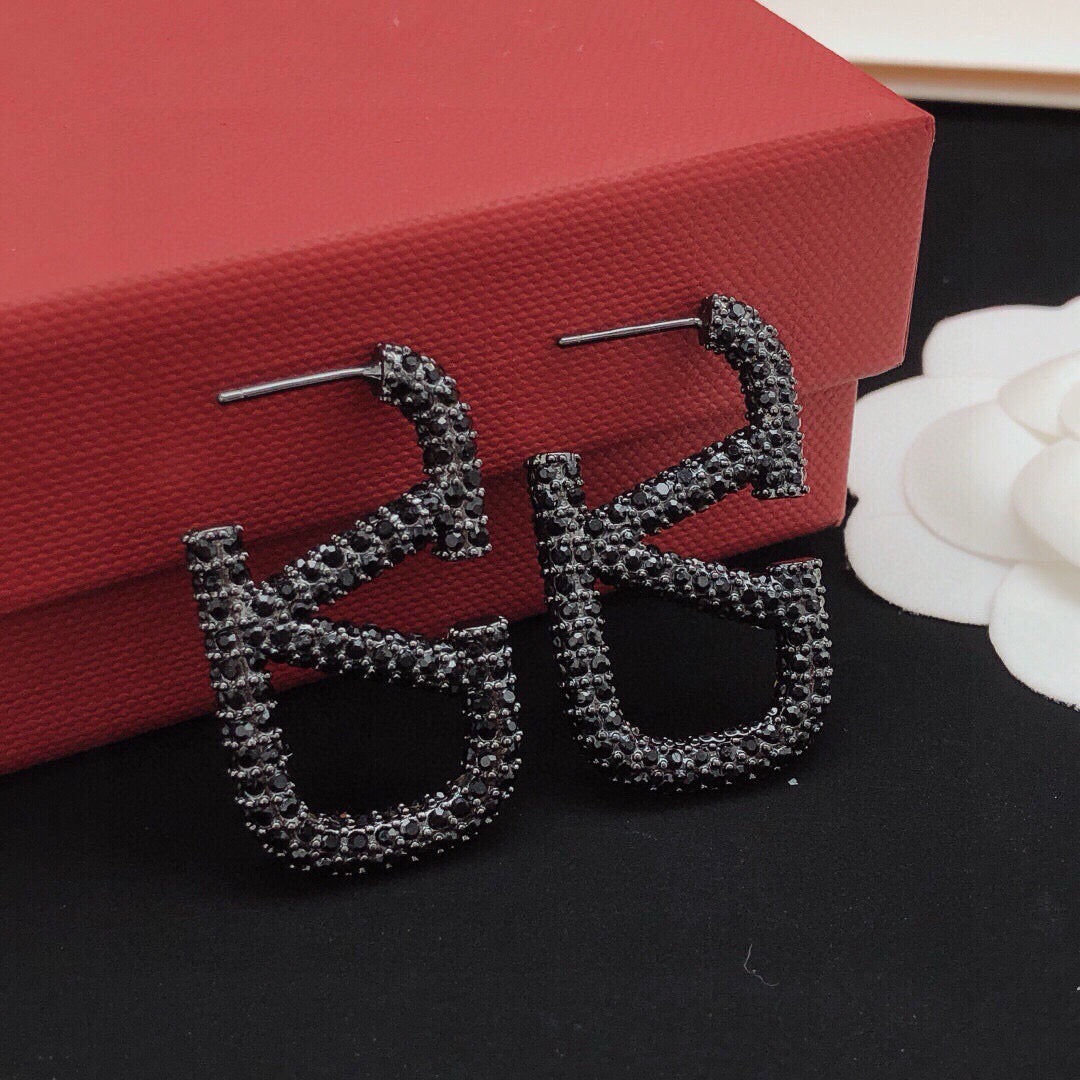 Martin Graham stud earrings in polished metal-tone
